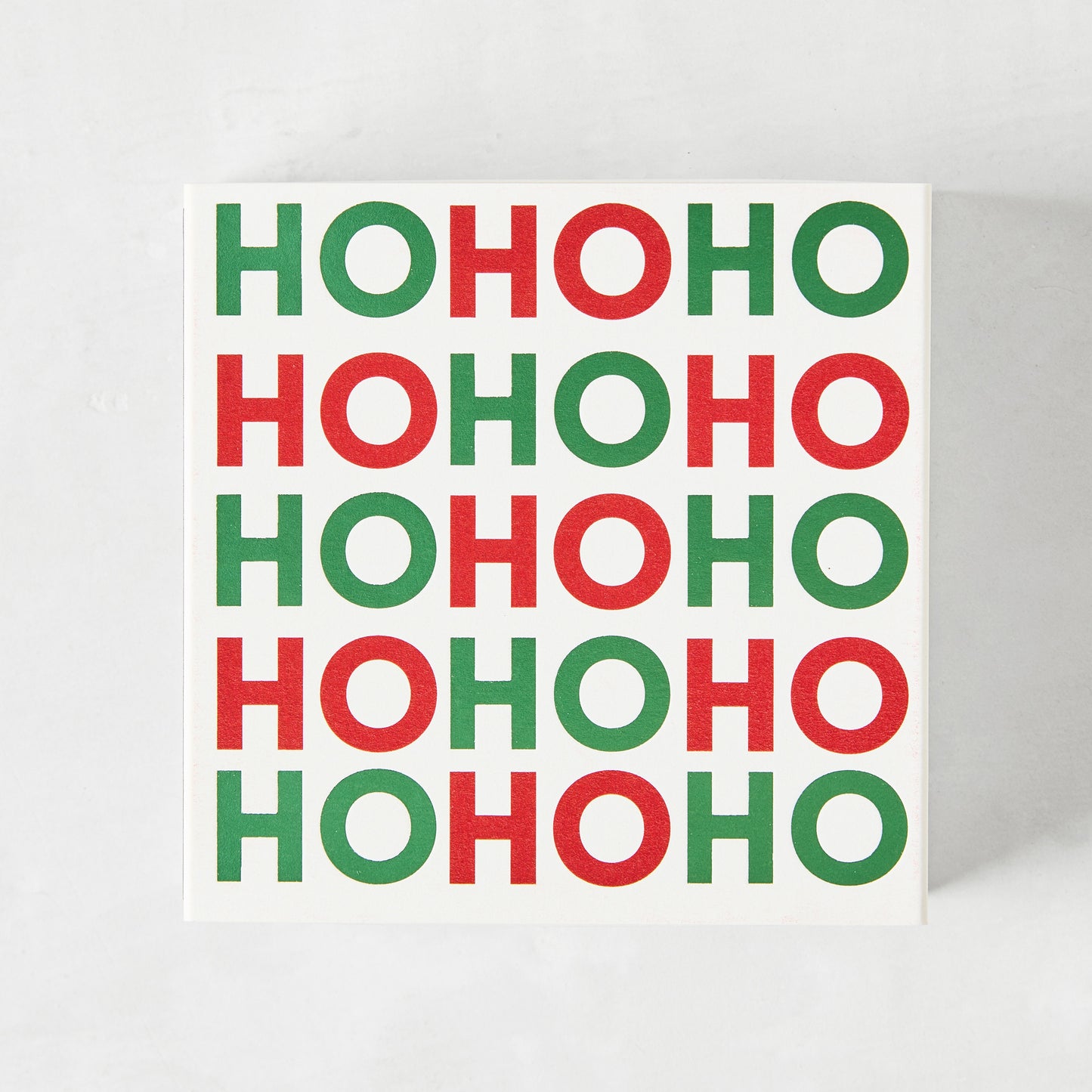 White square matchbox with "HOHOHO" in alternating red and green text.