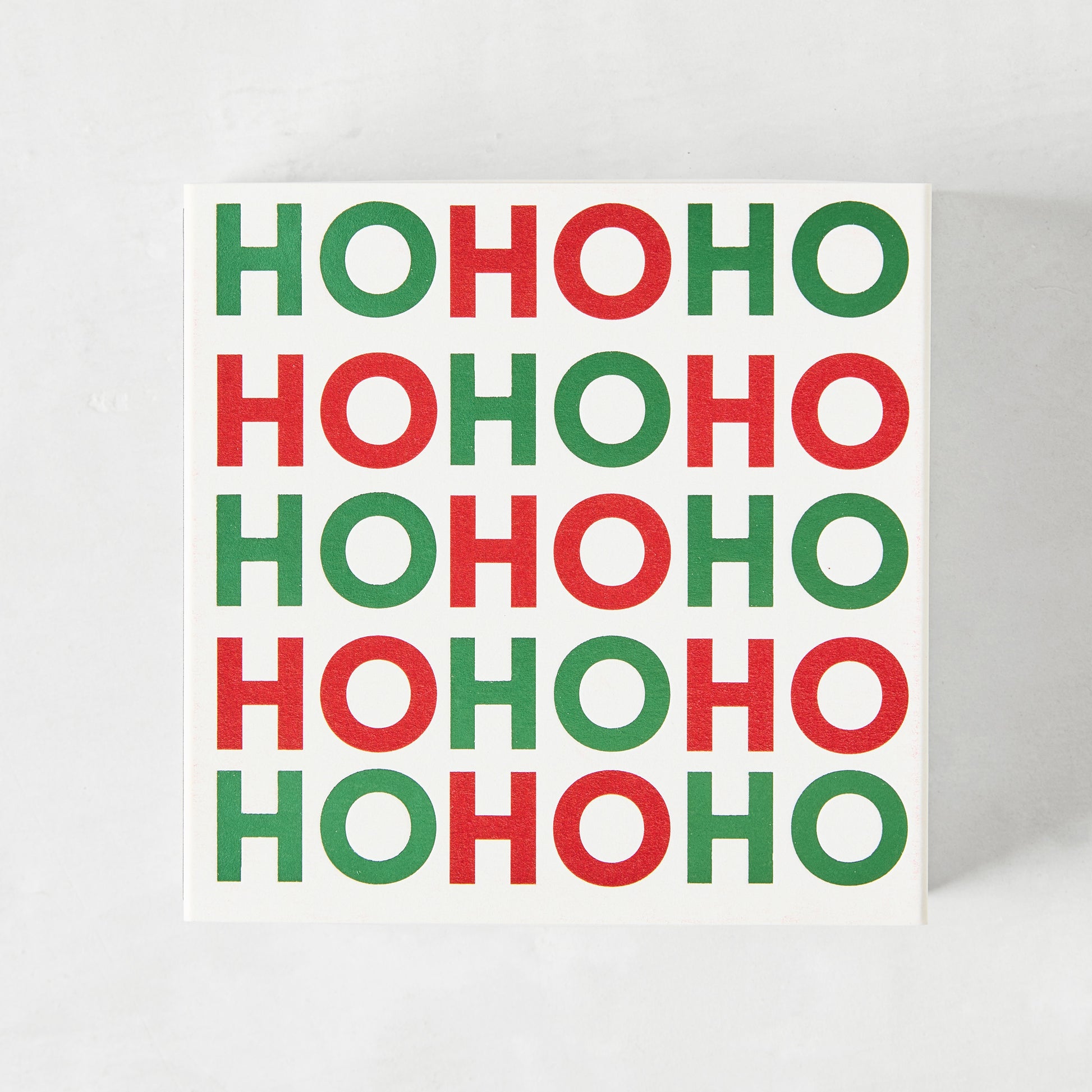 White square matchbox with "HOHOHO" in alternating red and green text.