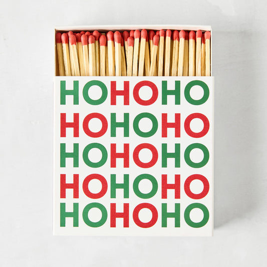 Oversized "Ho Ho Ho" Christmas matches in a white square box with red and green text, 4" long sticks.