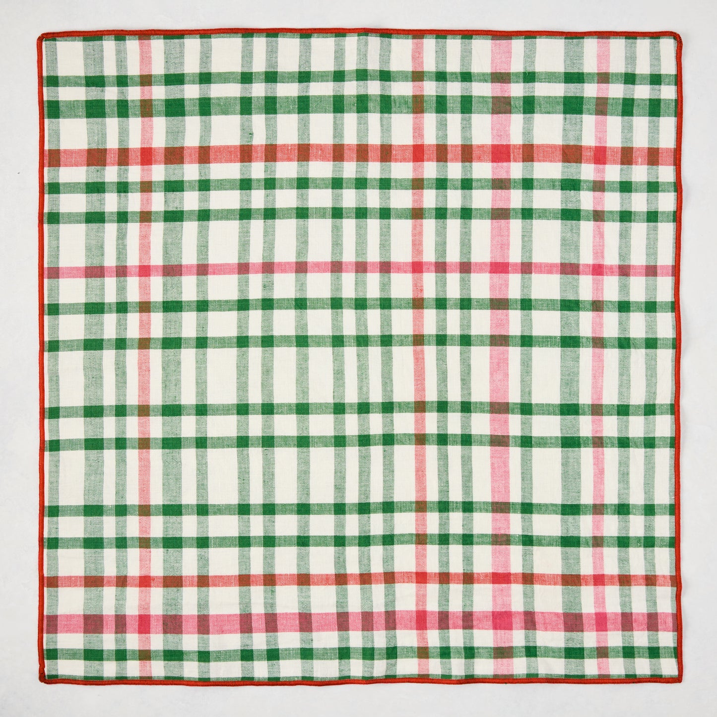 Holiday green and red gingham cotton napkin with embroidered red trim, 22" square.