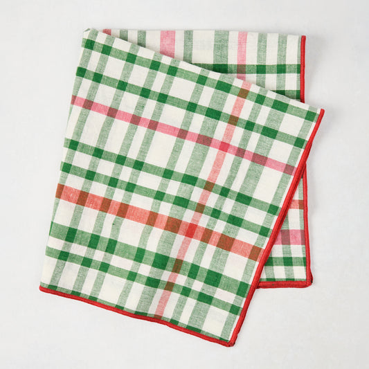 Folded Holiday Green and Red Gingham Cotton Napkin with embroidered red trim, 22" square.