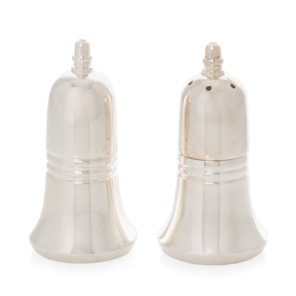 Silverplate bell-shaped salt and pepper shakers with minimalist design.