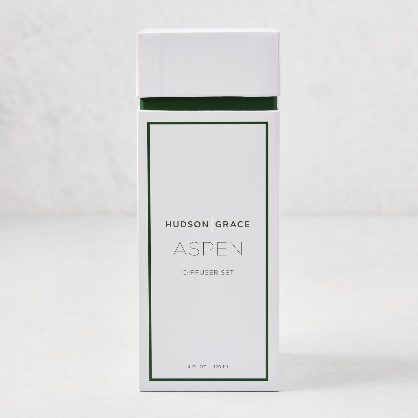 Hudson Grace Aspen Scented Reed Diffuser set in white box with green trim, 4 fl oz.