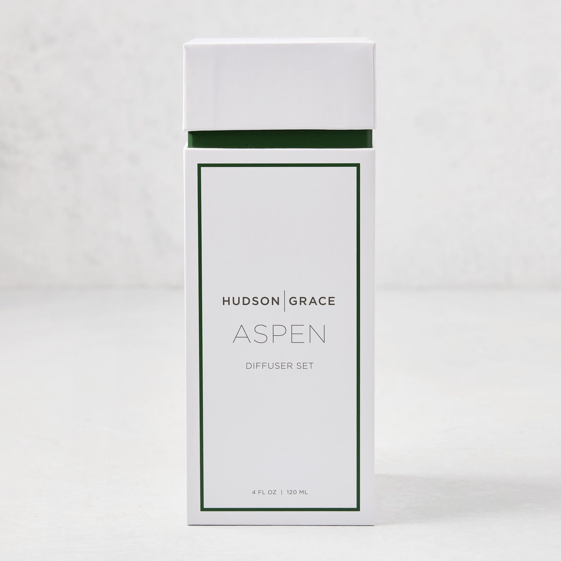 Hudson Grace Aspen Scented Reed Diffuser set in white box with green trim, 4 fl oz.