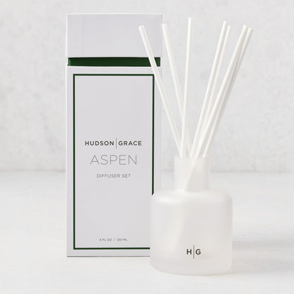 Hudson Grace Aspen 4oz frosted glass reed diffuser set with white reeds and matching box.