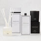 Hudson Grace Bleecker Scent Gift Set: white diffuser, room spray, and black candle with packaging.
