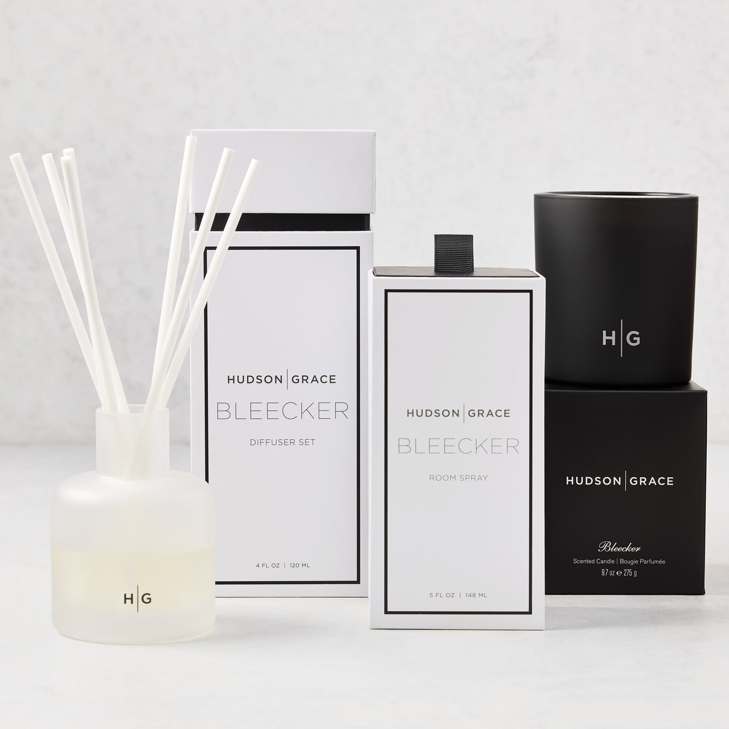Hudson Grace Bleecker Scent Gift Set: white diffuser, room spray, and black candle with packaging.