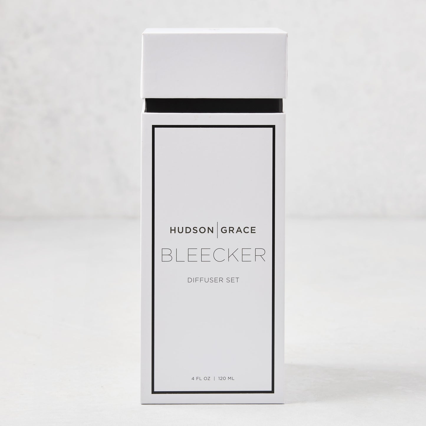 Hudson Grace Bleecker Scented Reed Diffuser set in a white box with black text, 4 fl oz.