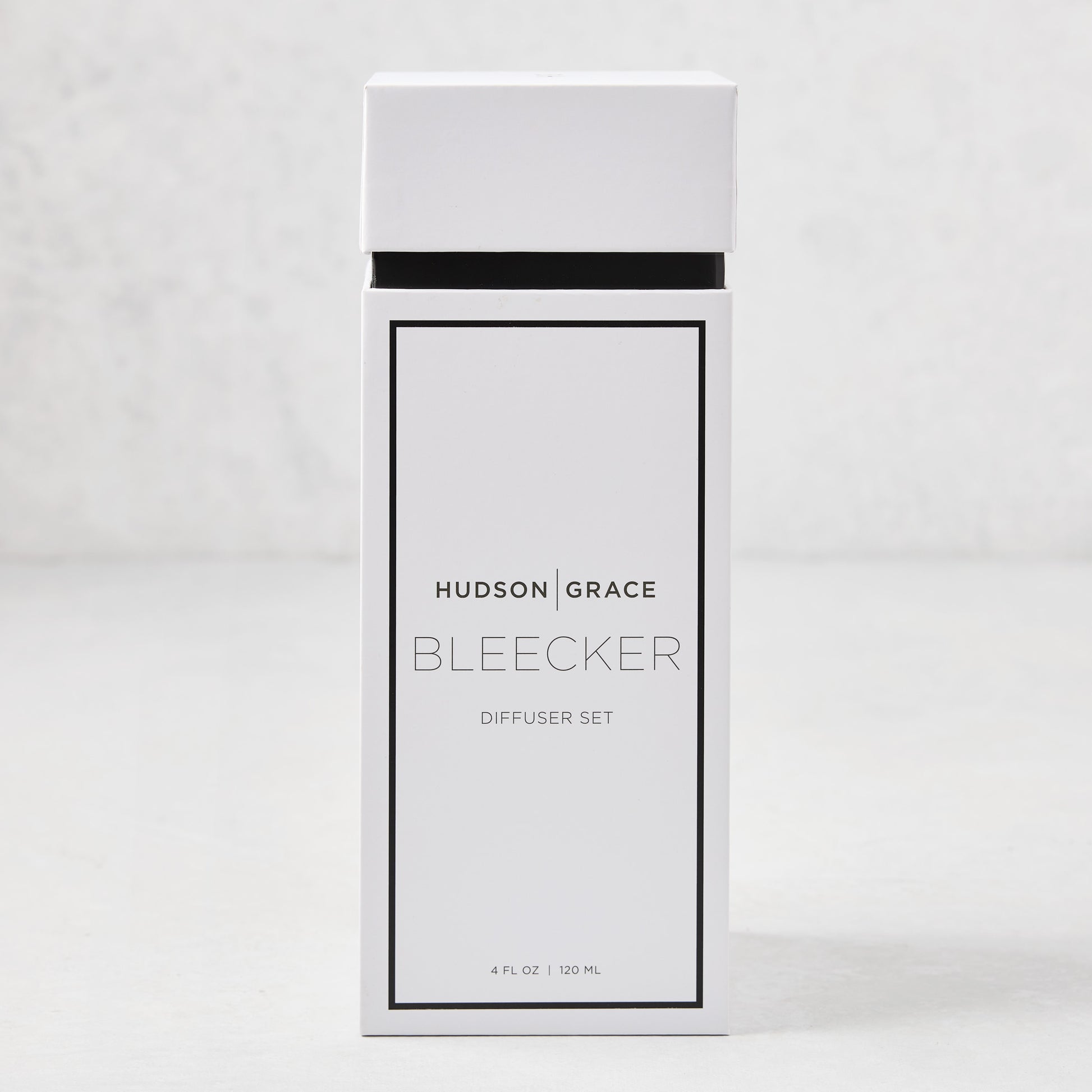 Hudson Grace Bleecker Scented Reed Diffuser set in a white box with black text, 4 fl oz.
