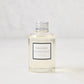 Hudson Grace Bleecker Scented Reed Diffuser Oil Refill, clear glass bottle with silver cap and white label.