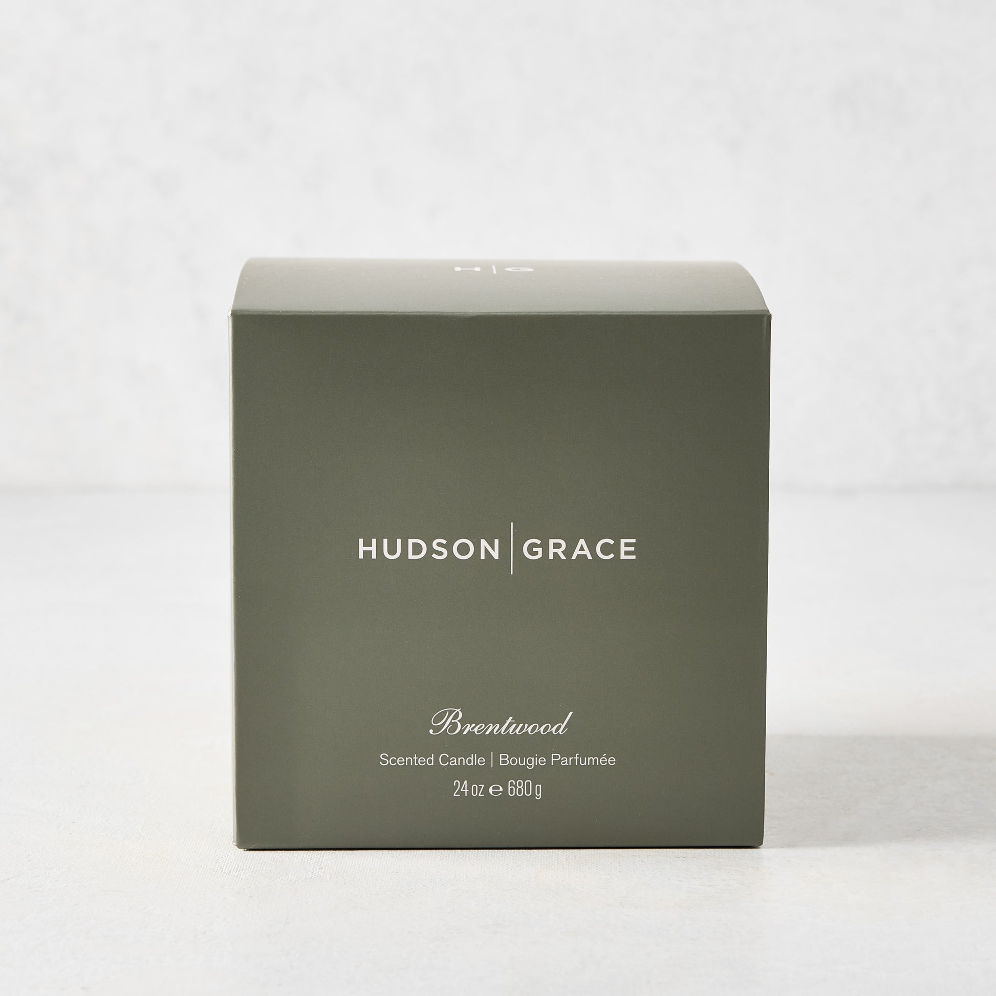 Hudson Grace Brentwood Scented 3-Wick Candle in a dark olive green gift box with white text.