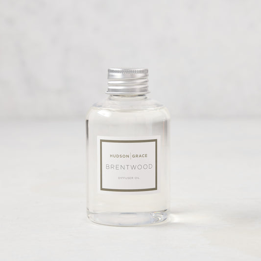 Hudson Grace Brentwood Diffuser Oil Refill, clear glass bottle with silver cap and white label.