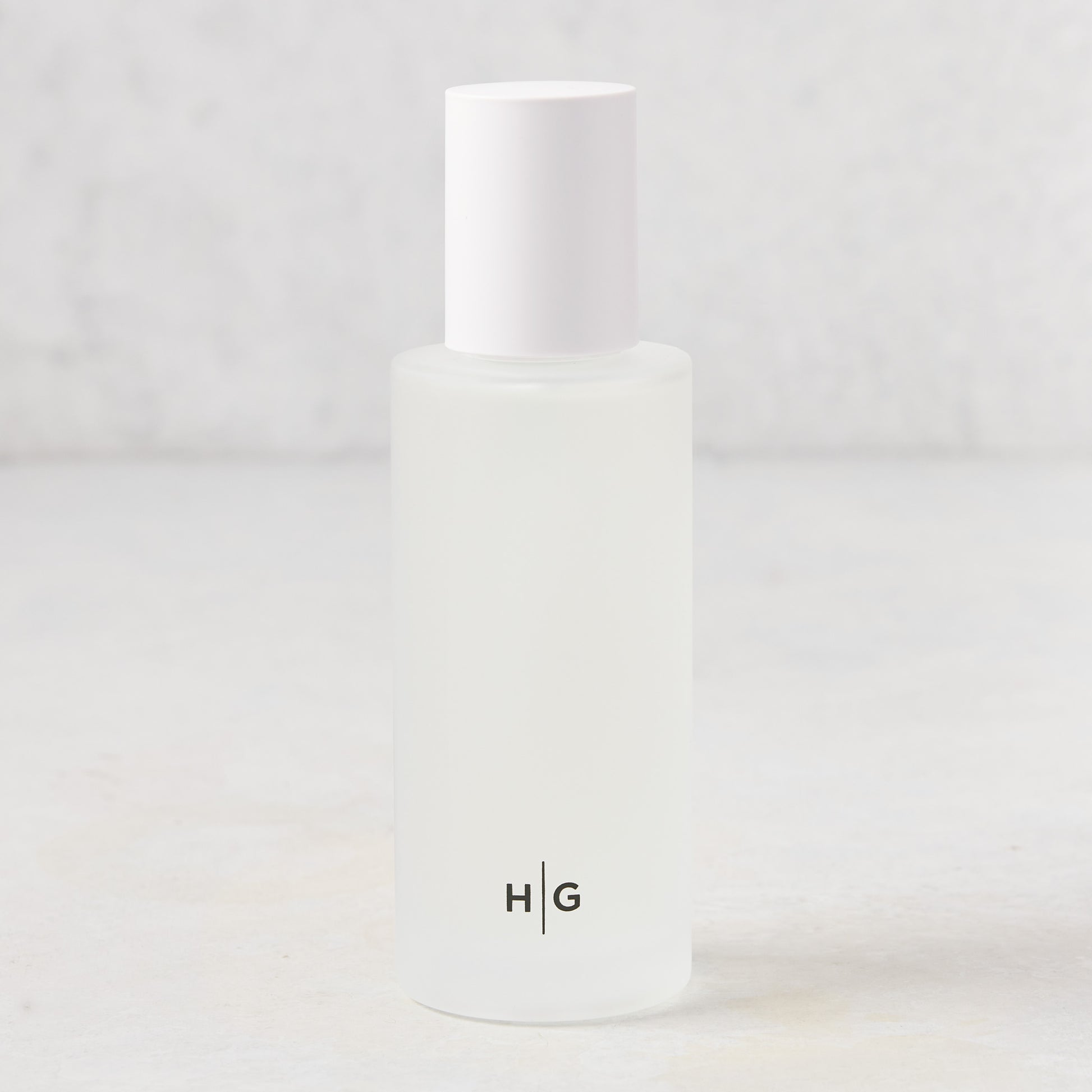 Hudson Grace Brentwood Room Spray, 5.08 oz, in a frosted glass bottle with white cap and HG logo.