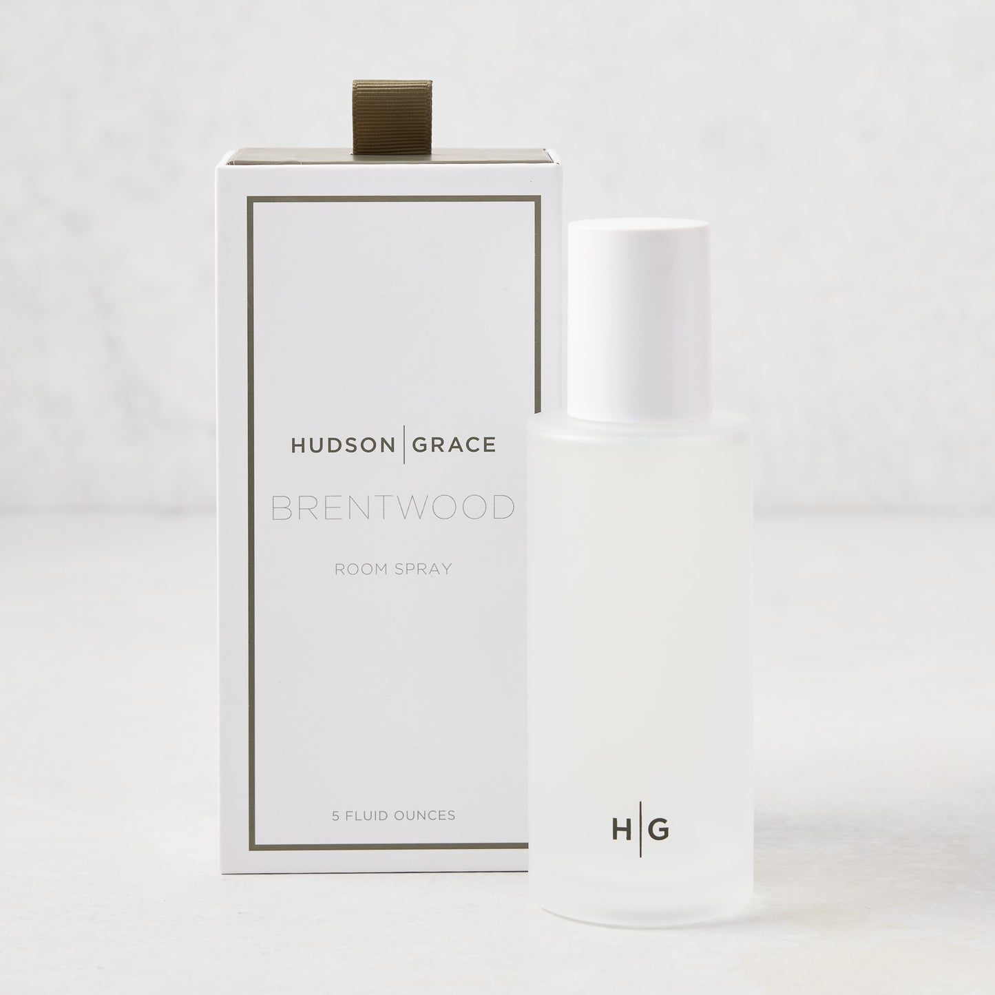 Hudson Grace Brentwood Room Spray, 5 oz frosted glass bottle with white cap, next to its white box.