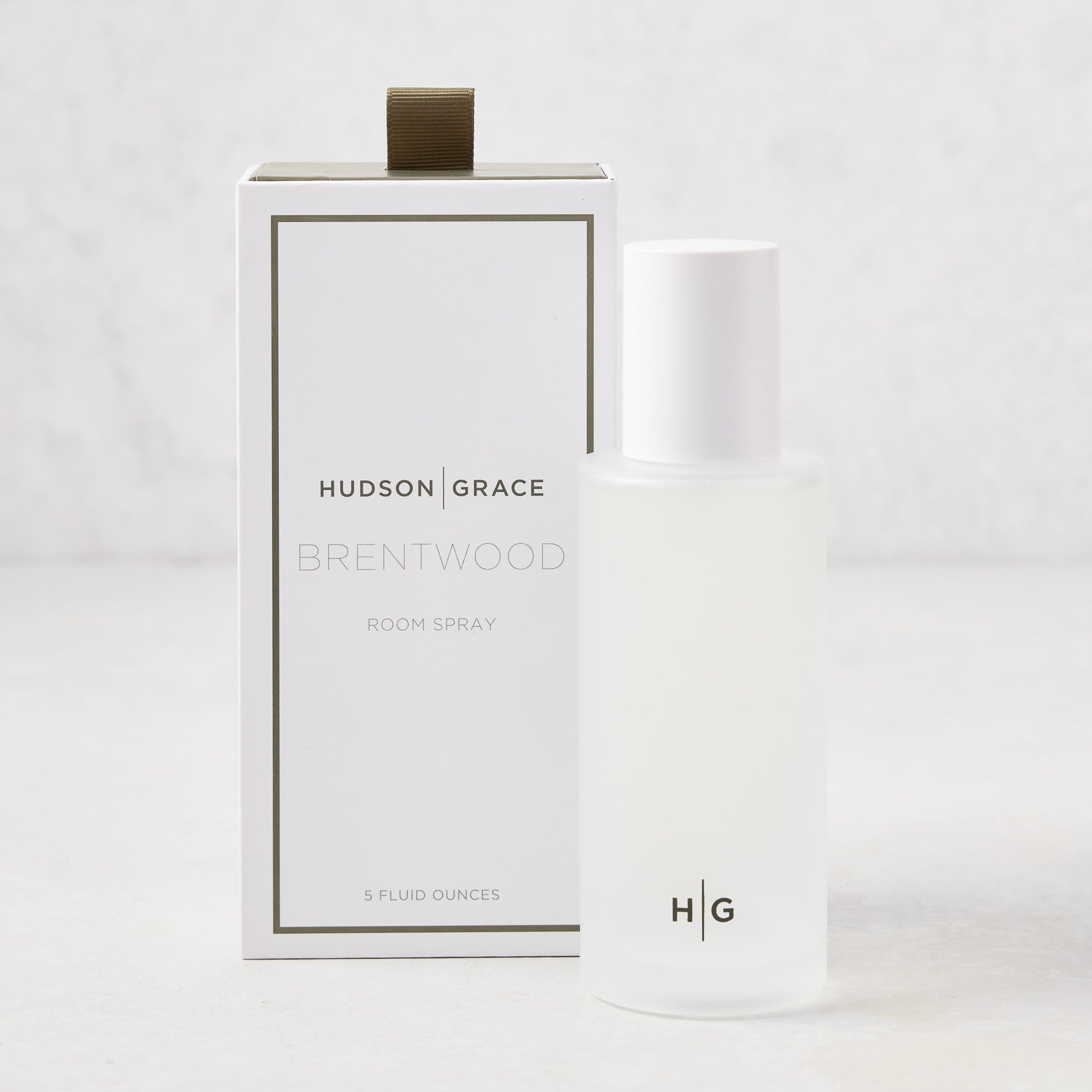 Hudson Grace Brentwood Room Spray, 5 oz frosted glass bottle with white cap, next to its white box.