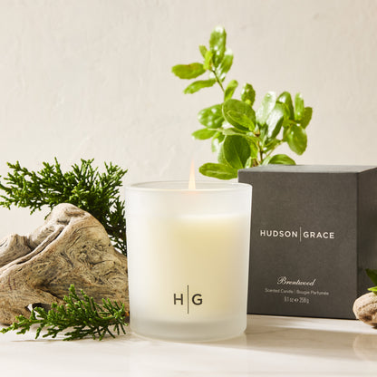 Hudson Grace Brentwood scented votive candle in a frosted glass vessel with a dark gray gift box.