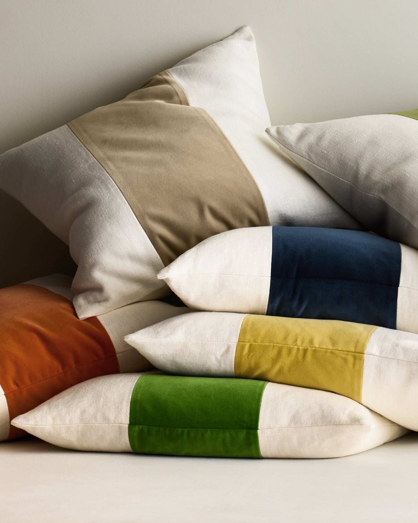 Hudson Grace color-block throw pillows with velvet panels in assorted colors