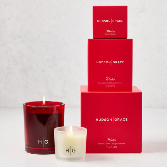 Hudson Grace Winter Candle Gift Set: red glass candle, frosted votive, and three red boxed candles.