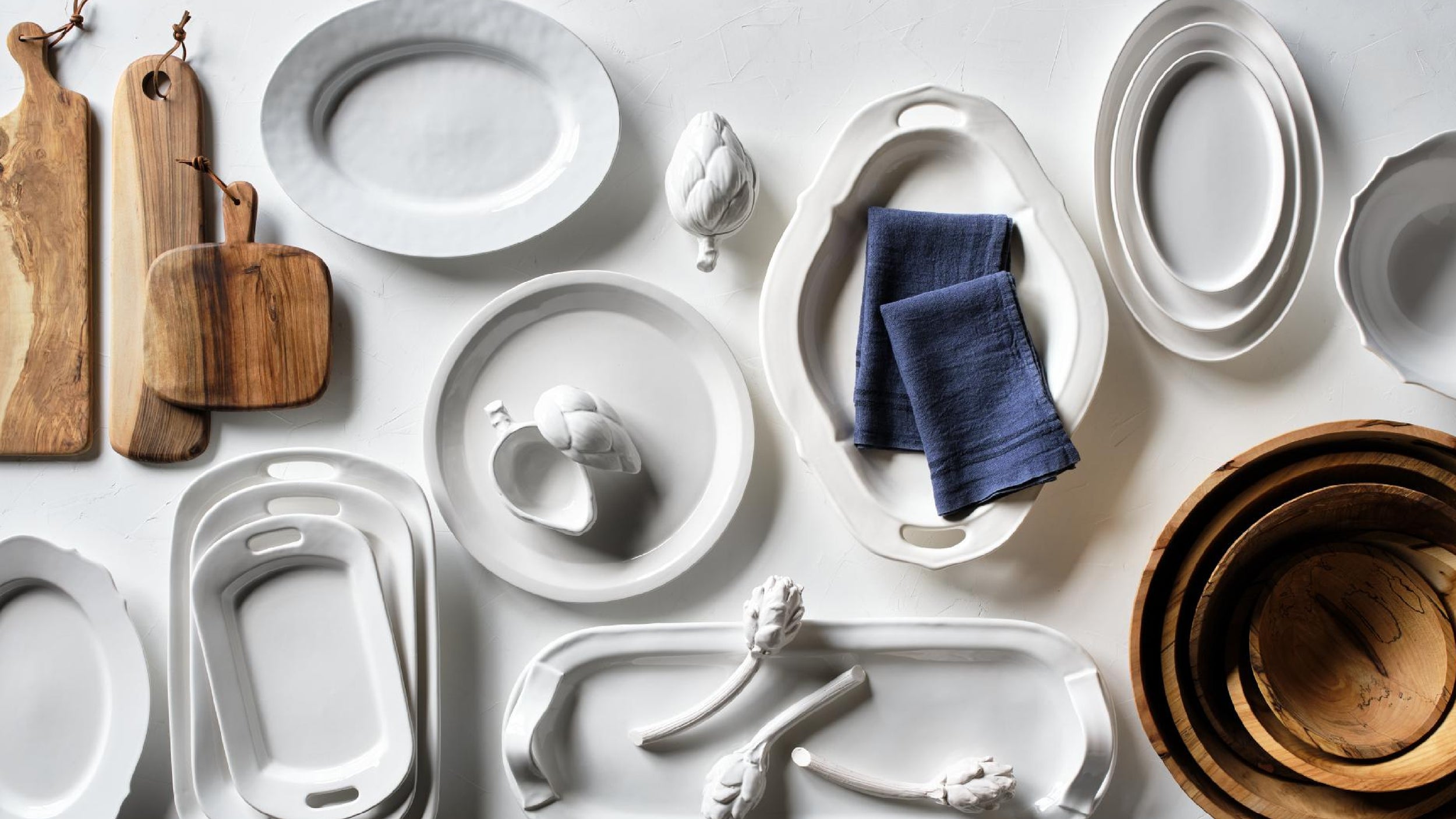 Hudson Grace European-made white serving platters in assorted oval, round, and rectangular shapes
