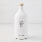 Hudson Grace Extra Virgin Olive Oil in a white ceramic bottle with a wood cork and black label.