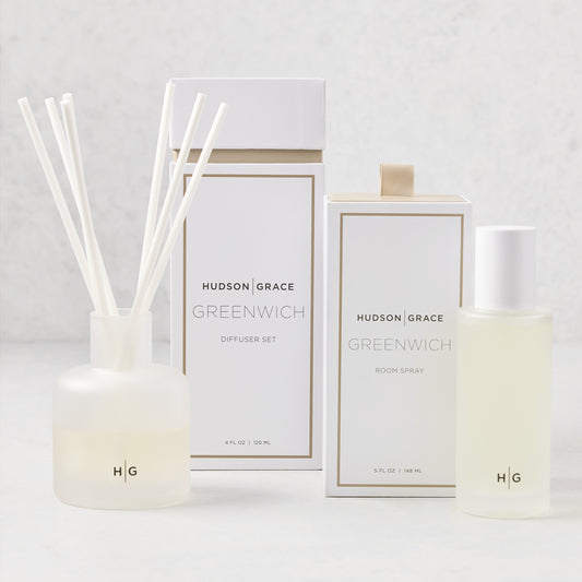 Hudson Grace Greenwich Room Spray and Diffuser Gift Set with frosted glass vessels and white boxes.