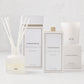 Hudson Grace Greenwich Scent Gift Set: white candle, diffuser, and room spray with gold accents.