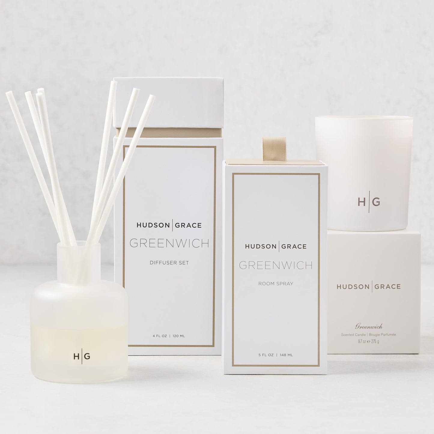 Hudson Grace Greenwich Scent Gift Set: white candle, diffuser, and room spray with gold accents.