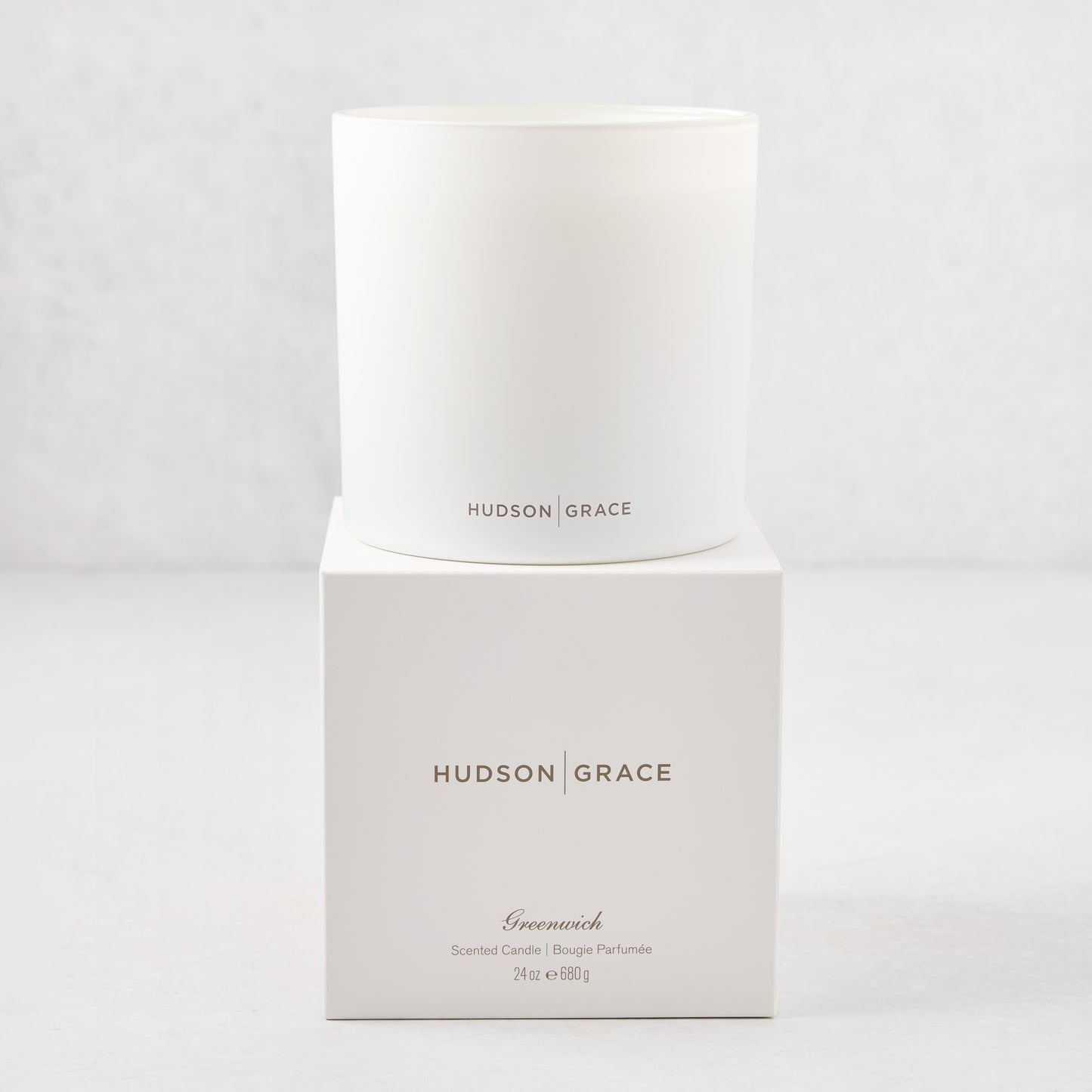 Hudson Grace Greenwich 3-wick candle in a white glass vessel, with matching white box.