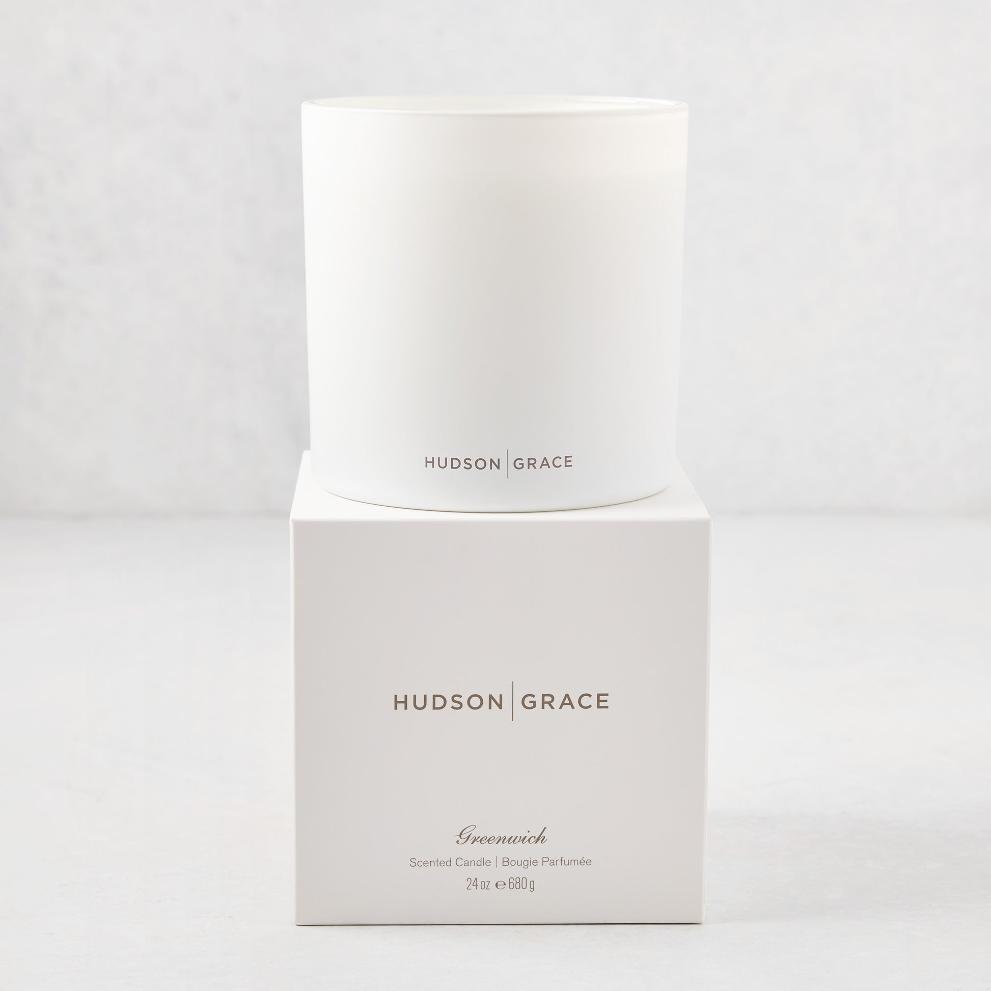 Hudson Grace Greenwich 3-wick candle in a white glass vessel, with matching white box.