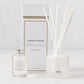 Hudson Grace Greenwich Scented Reed Diffuser set with frosted glass vessel, 6 white reeds, and 4 fl oz oil bottle.