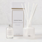 Hudson Grace Greenwich Scented Reed Diffuser set with frosted glass vessel, 6 white reeds, and 4 fl oz oil bottle.