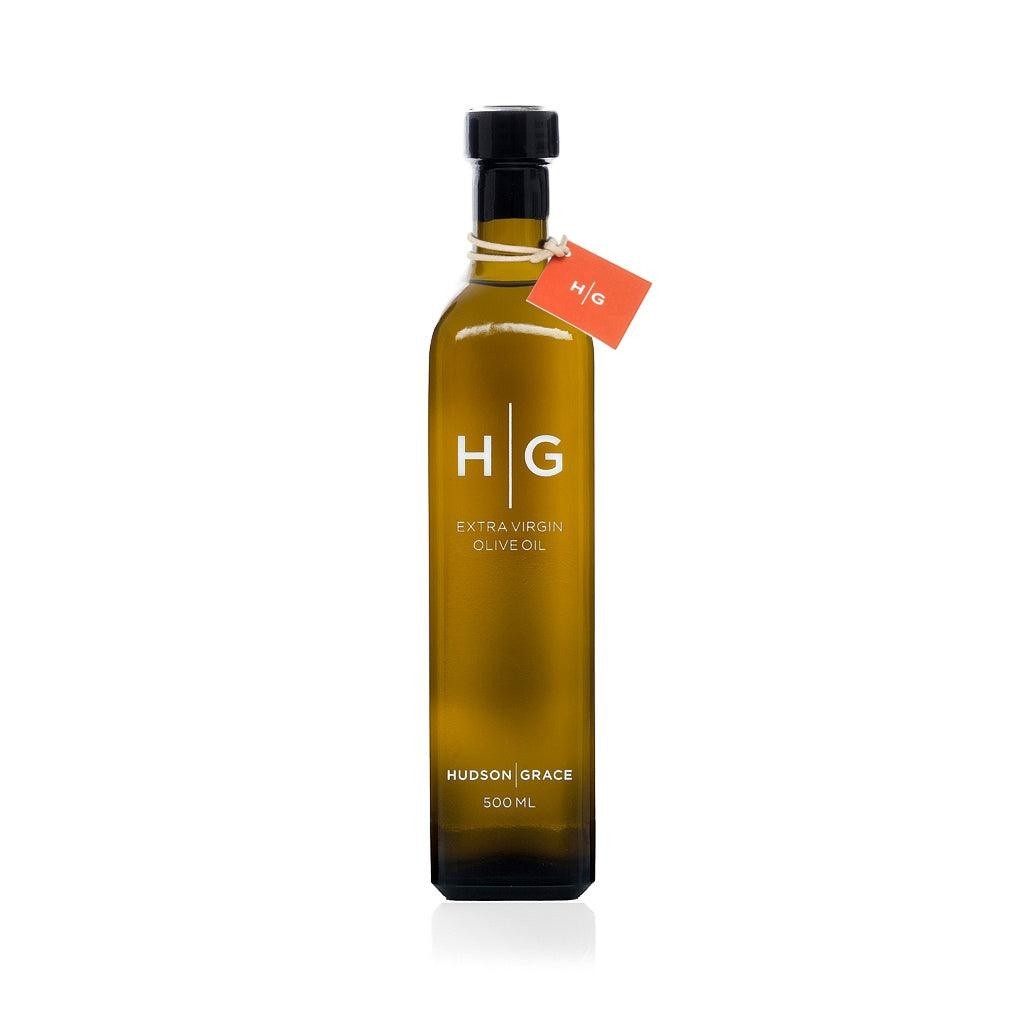 Hudson Grace 500ml extra virgin olive oil in a dark amber glass bottle with a black cap and orange tag.
