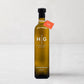 Hudson Grace 500ml extra virgin olive oil in a dark amber glass bottle with a black cap and orange tag.