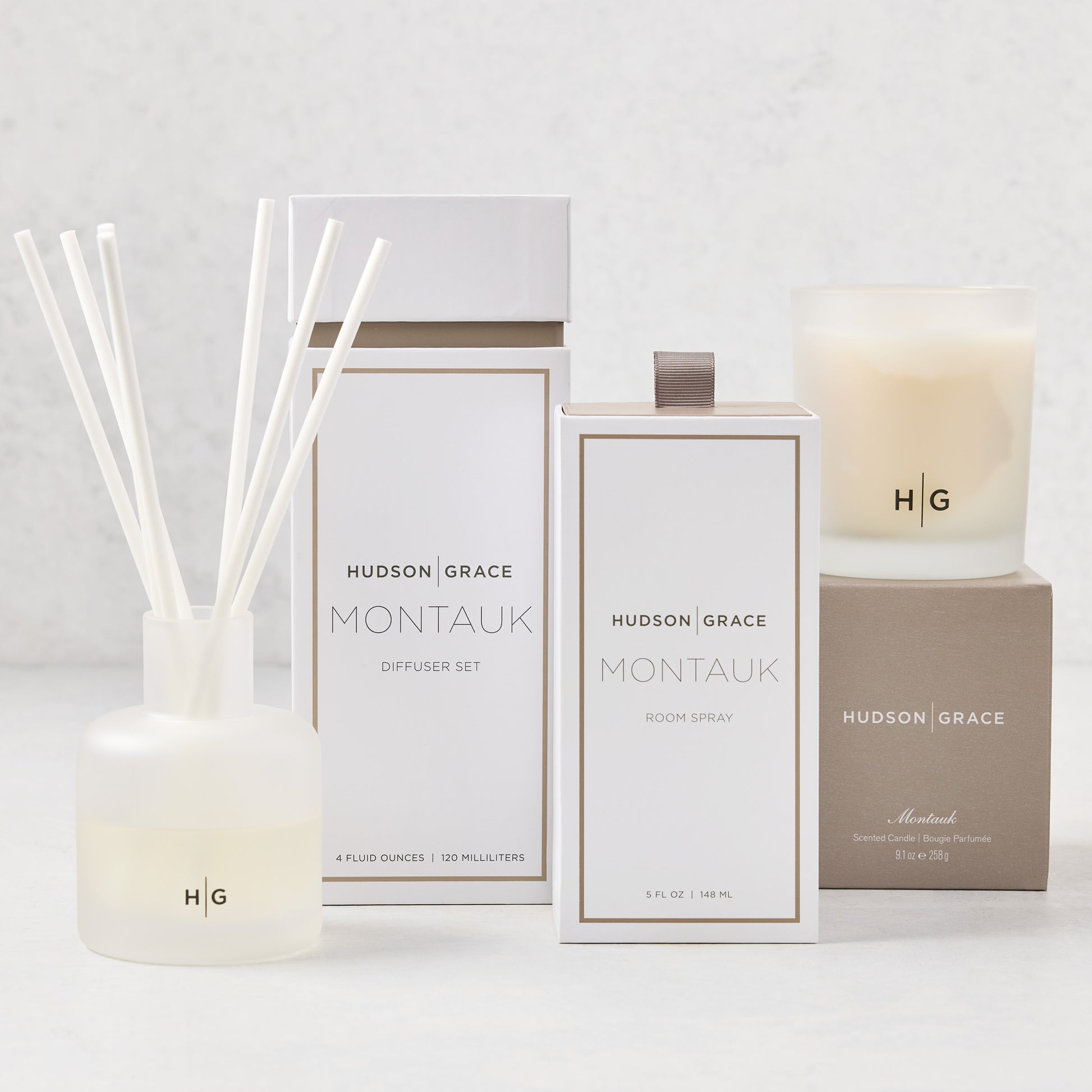Hudson Grace Montauk Scent Gift Set: white diffuser, room spray, and candle with beige packaging.