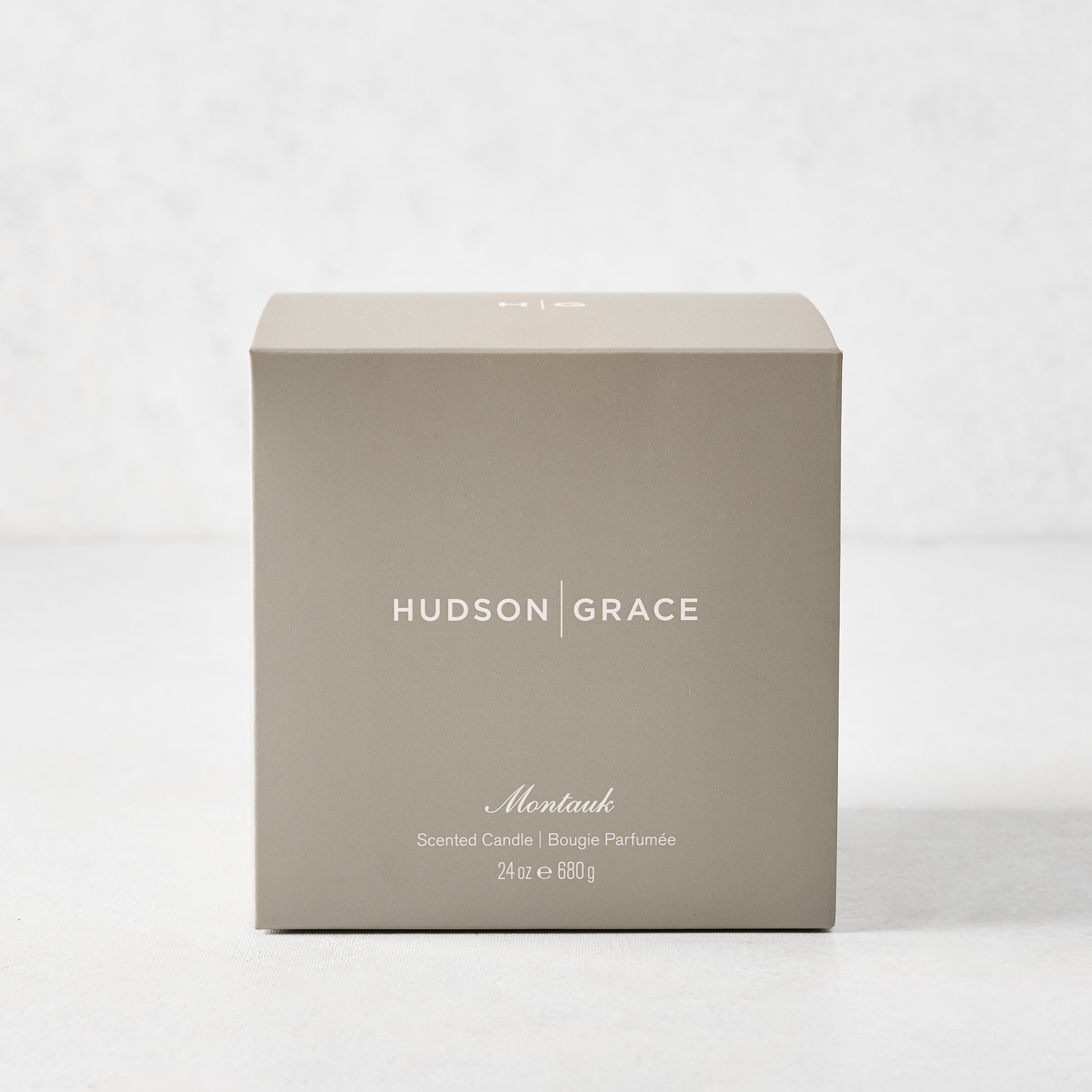 Hudson Grace Montauk 3-Wick Scented Candle in an elegant light brown gift box with white text.