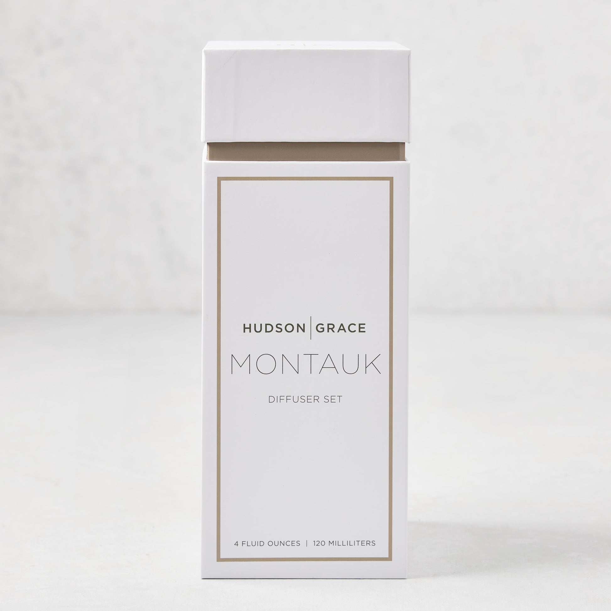 Hudson Grace Montauk Scented Reed Diffuser Set, white box with brown trim, 4 fl oz.