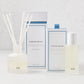Hudson Grace Montecito Room Spray and Diffuser Gift Set: frosted glass bottles, white boxes with blue accents.