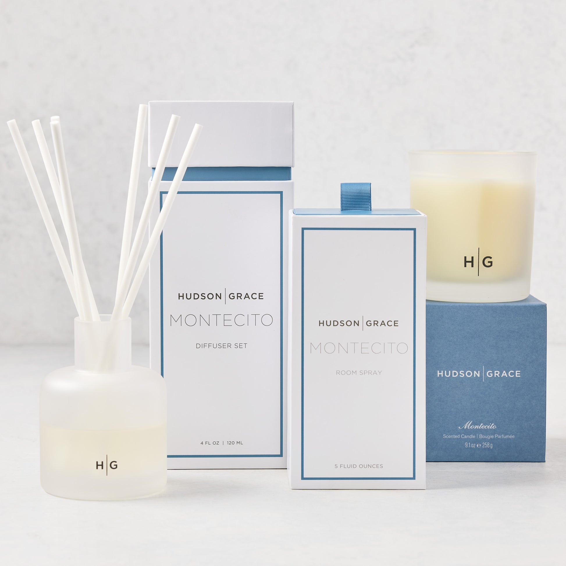 Hudson Grace Montecito Scent Gift Set: white diffuser, room spray, and candle with blue accents.