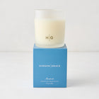 Hudson Grace Montecito scented candle in a frosted glass vessel with a blue gift box.