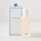 Hudson Grace Montecito 5 oz room spray in a frosted glass bottle with white cap, beside its white and blue box.