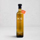 Hudson Grace 500ml extra virgin olive oil in a dark amber glass bottle with a black cap and orange tag.