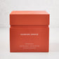 Hudson Grace Original 4-Wick Scented Candle in an orange gift box with white text.