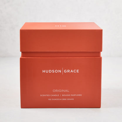 Hudson Grace Original 4-Wick Scented Candle in an orange gift box with white text.