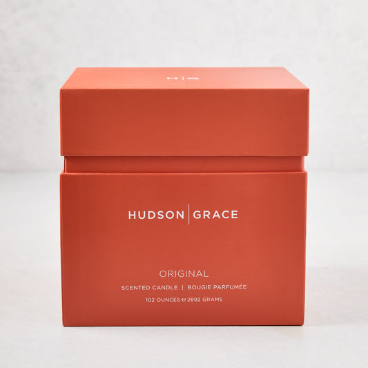 Hudson Grace Original 4-Wick Scented Candle in an orange gift box with white text.