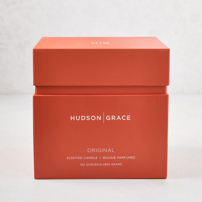 Hudson Grace Original 4-Wick Scented Candle in an orange gift box with white text.