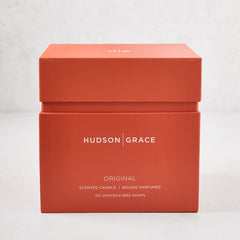 Hudson Grace Original 4-Wick Scented Candle in an orange gift box with white text.