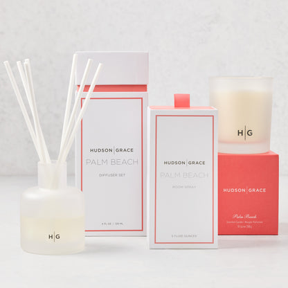 Hudson Grace Palm Beach scent gift set: white diffuser, room spray, and candle with coral accents.