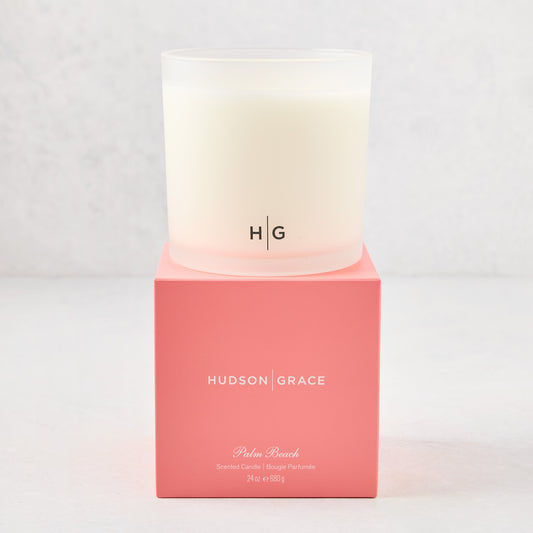Hudson Grace Palm Beach 3-wick candle in a frosted glass vessel with a coral pink box.