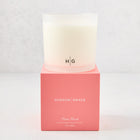 Hudson Grace Palm Beach 3-wick candle in a frosted glass vessel with a coral pink box.