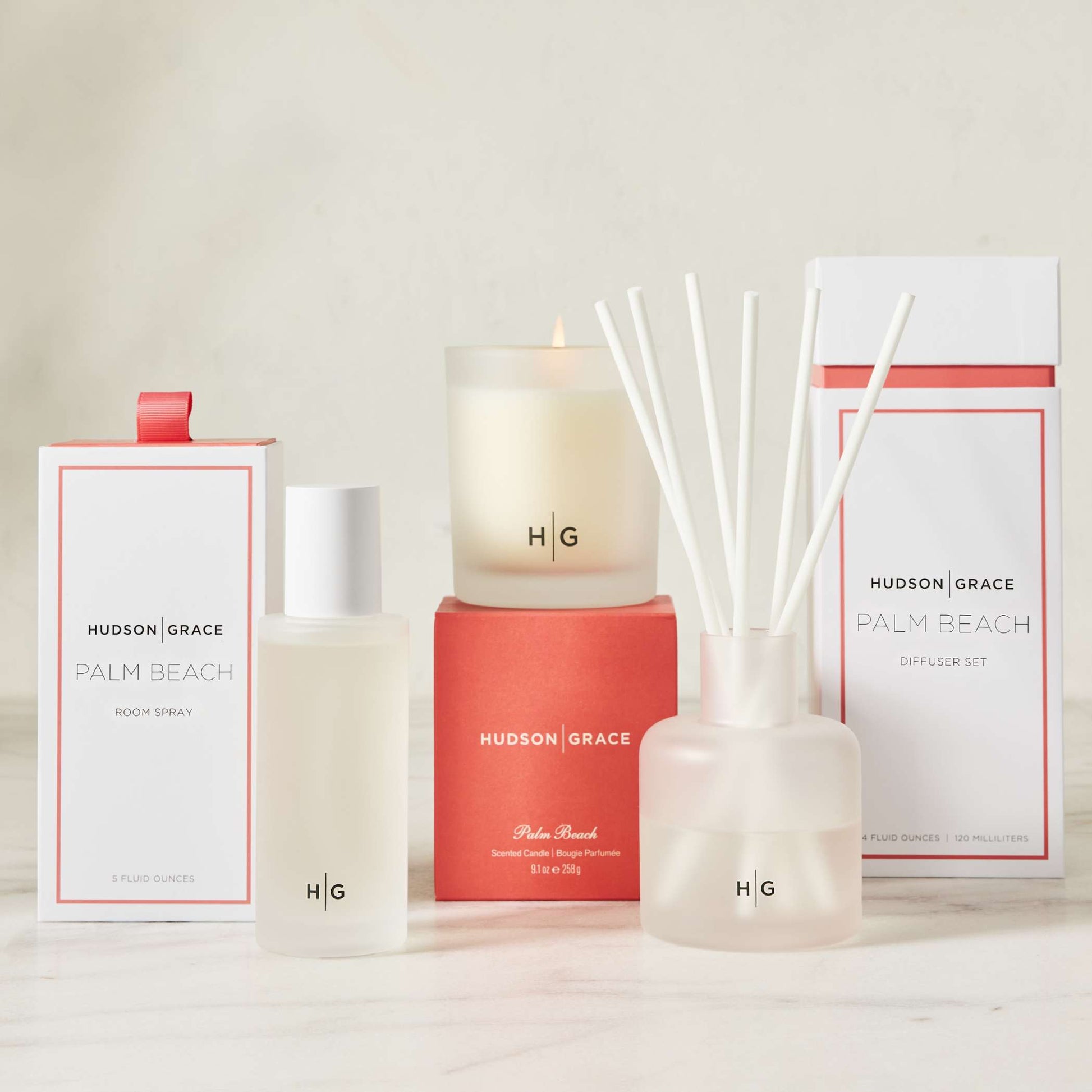 Hudson Grace Palm Beach scented room spray, candle, and reed diffuser set with white packaging.